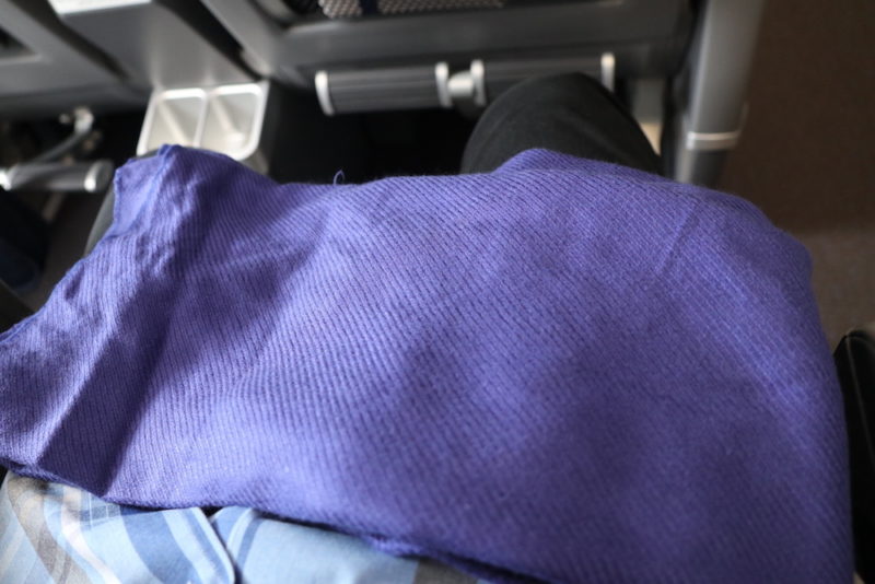 a purple cloth on a person's lap
