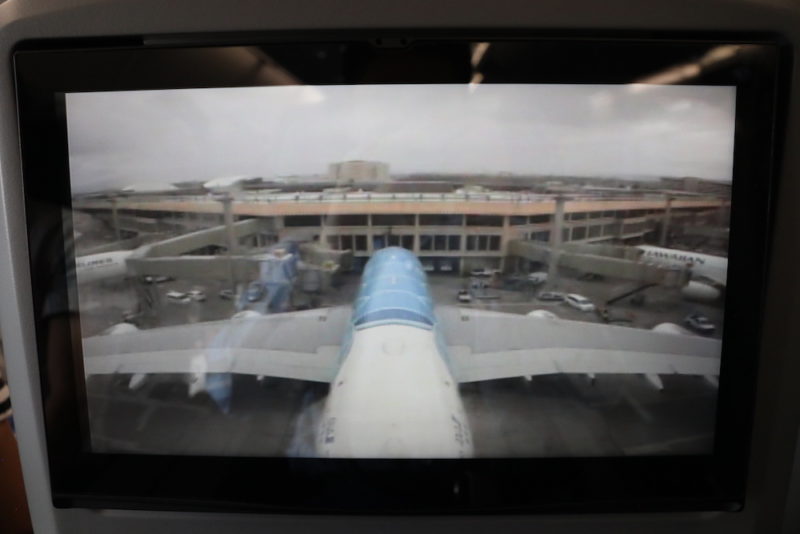 a screen with a plane in the background