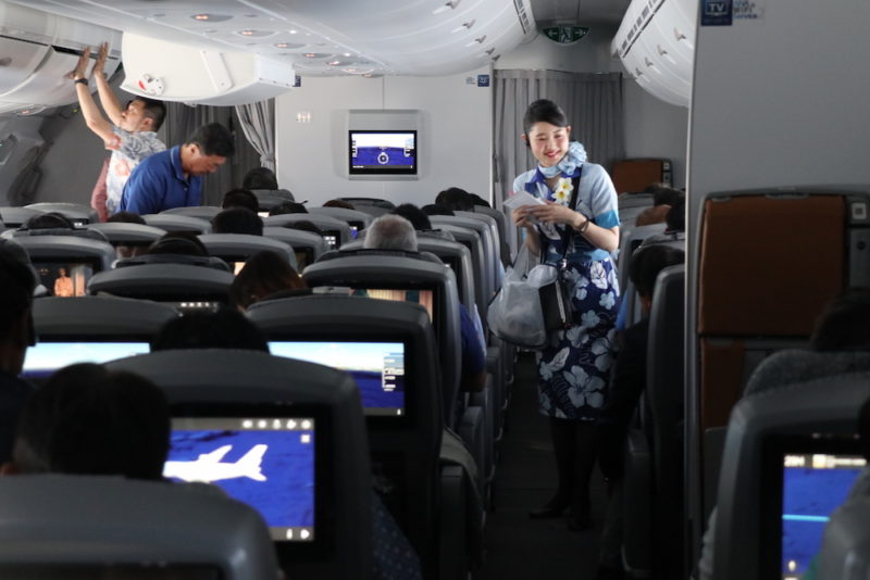 a woman standing in an airplane