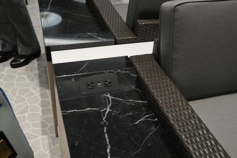 a black marble table with a power outlet