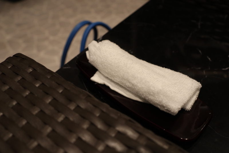 a white towel on a black surface