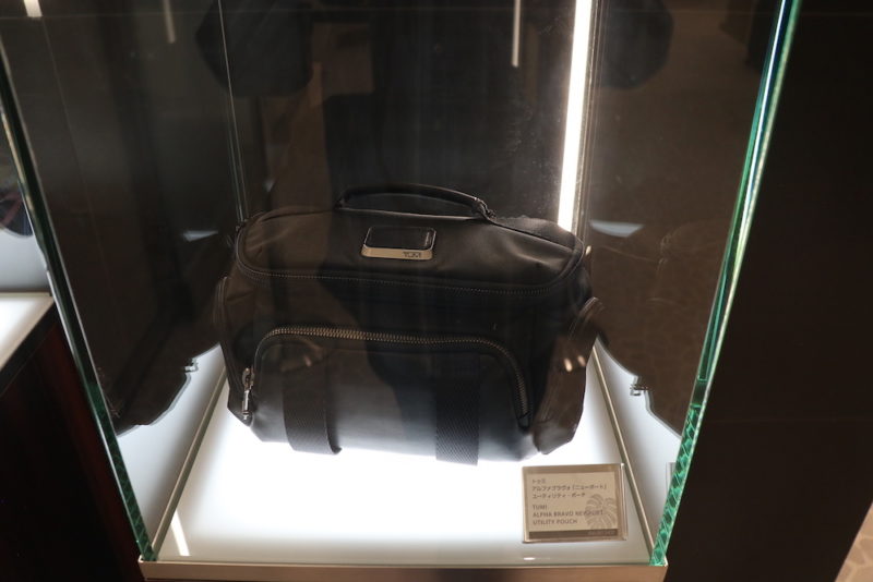 a black bag in a glass case
