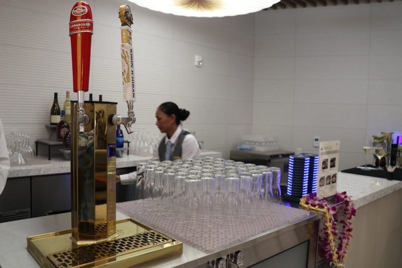 a bar with many glasses on a counter