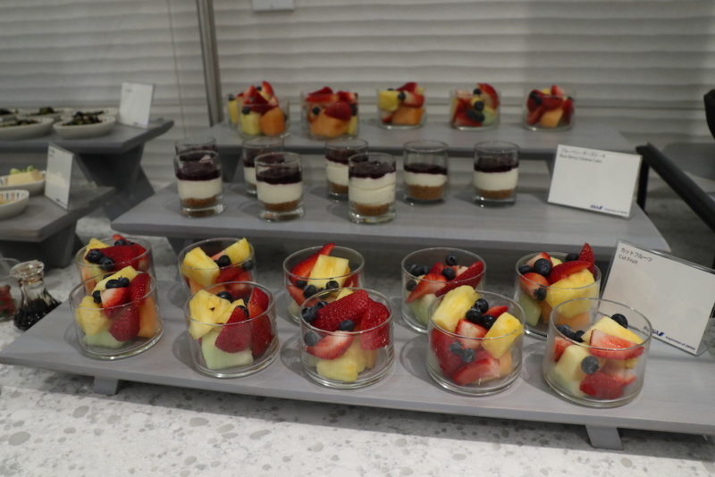 a tray of fruit desserts
