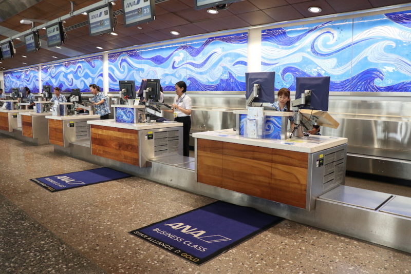 people working at a check-in counter