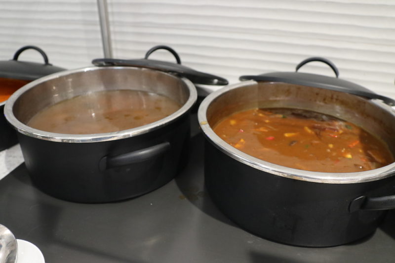 two pots with soup in them
