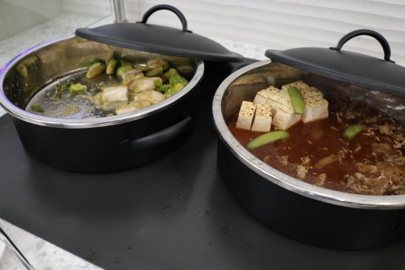 a couple of pots with food inside