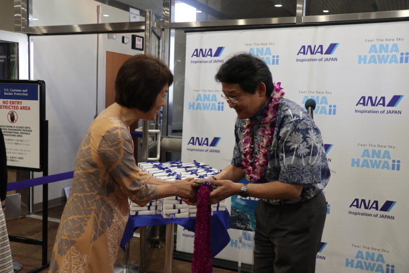 a man and woman in a hawaiian shirt