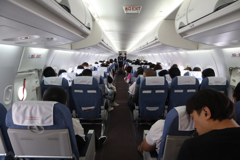 a group of people sitting on an airplane