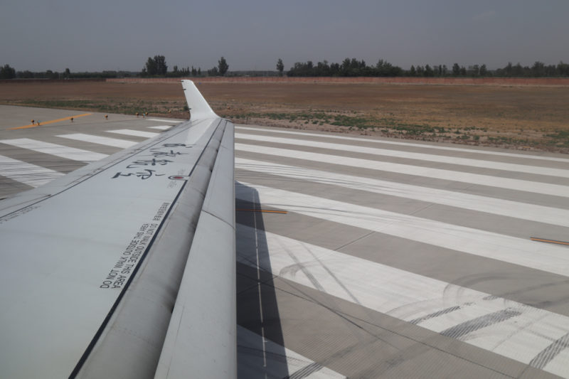 an airplane wing on a runway