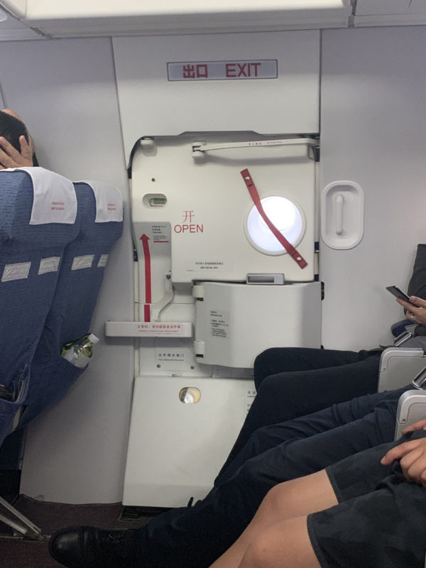 a group of people sitting in an airplane