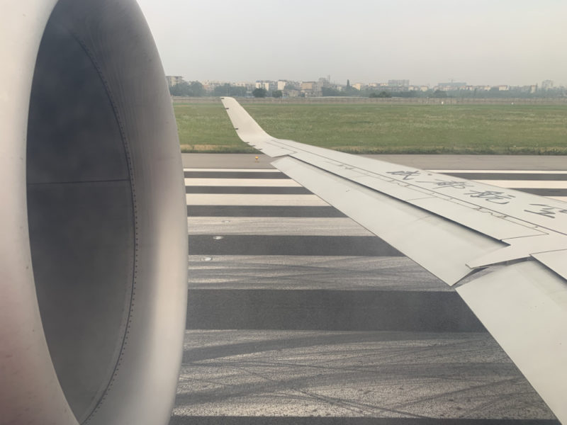 an airplane wing on a runway