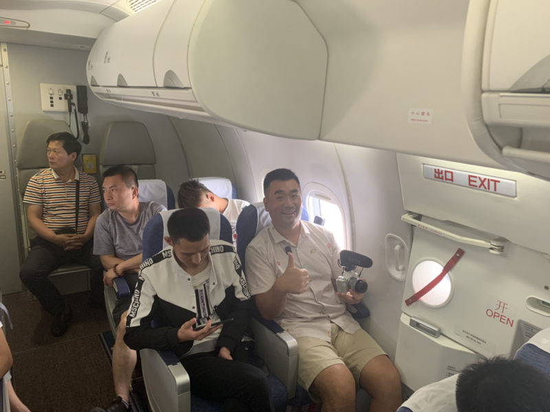 a group of people sitting on an airplane