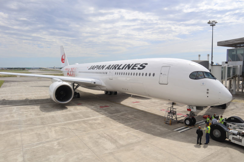 a large white airplane at an airport