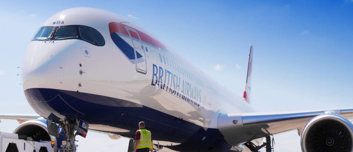 a man standing next to a large airplane