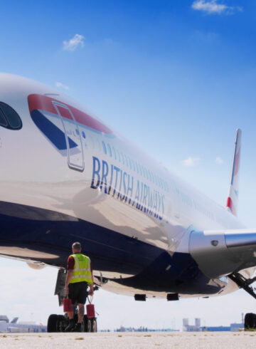 a man standing next to a large airplane