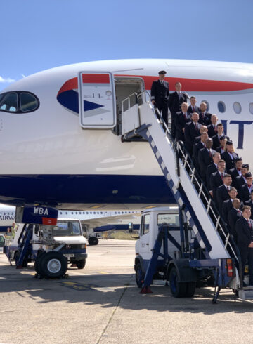 a group of people standing on a plane