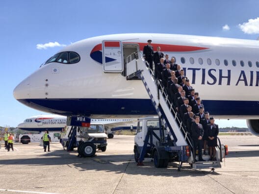 a group of people standing on a plane
