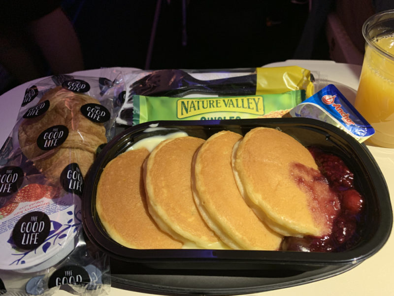 a tray of pancakes and jam