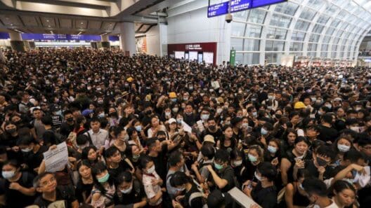 a large crowd of people in a station