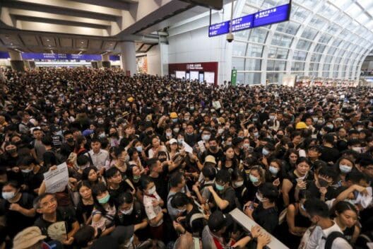 a large crowd of people in a station