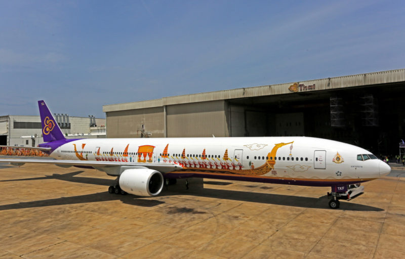 a white airplane with a painted design on it