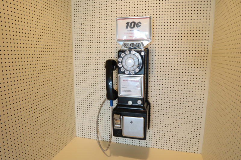 a pay phone on a wall