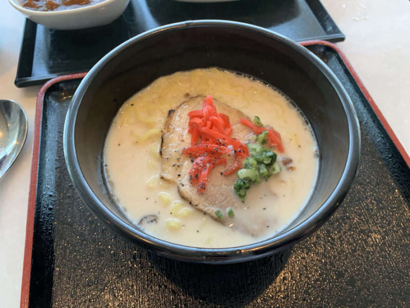 a bowl of soup with meat and vegetables