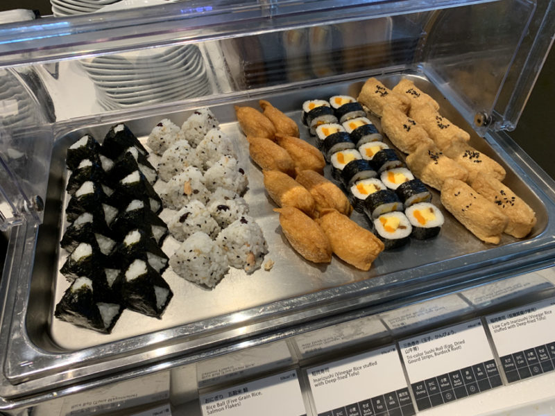 a tray of sushi on a shelf