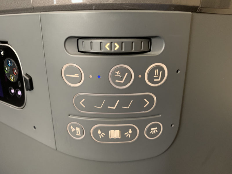 a close up of a seat control panel