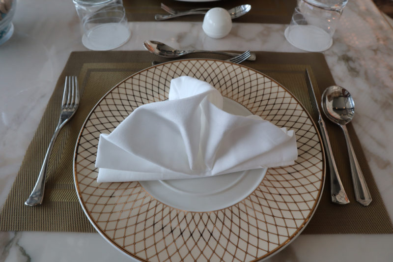 a plate with a napkin folded on it