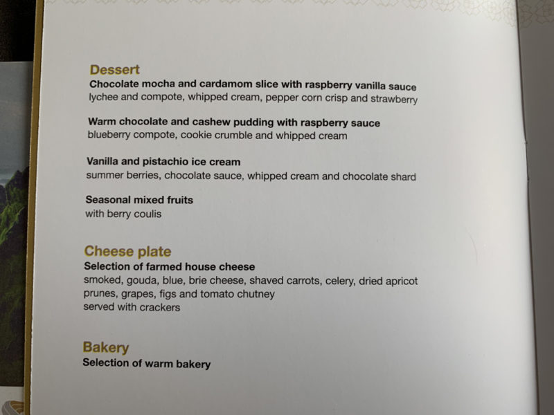 a menu of desserts on a white surface
