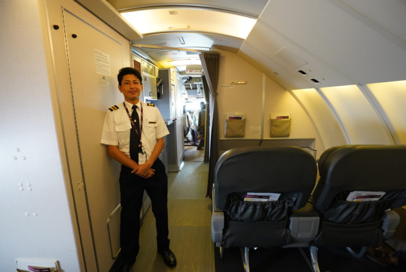 a man standing in an airplane