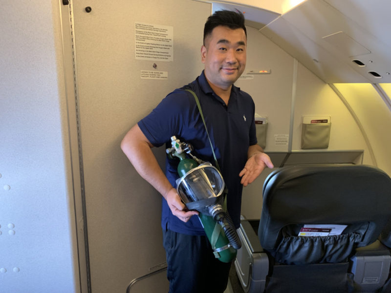 a man holding a oxygen mask