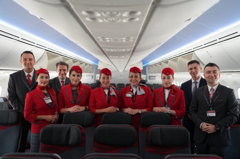 a group of people in red uniforms