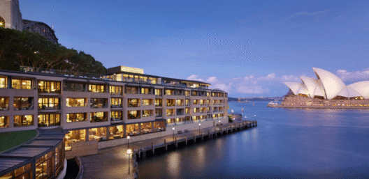 a building next to a body of water