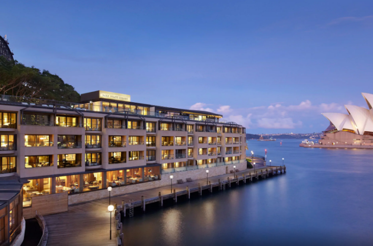 a building next to a body of water