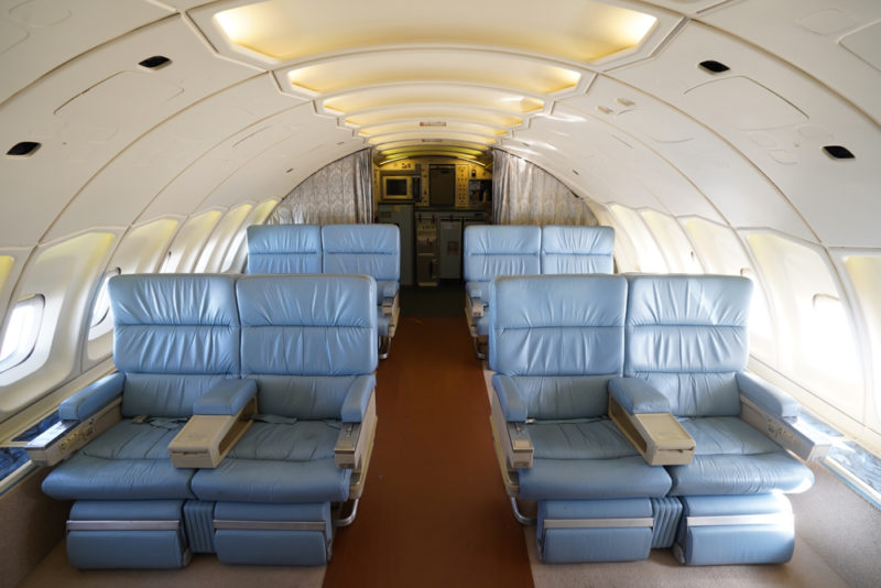 a plane with blue chairs