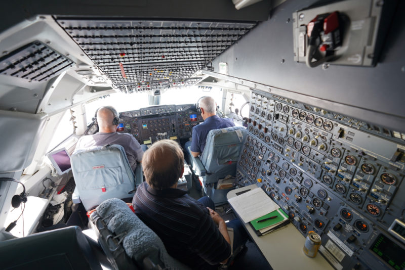 people in the cockpit of a plane