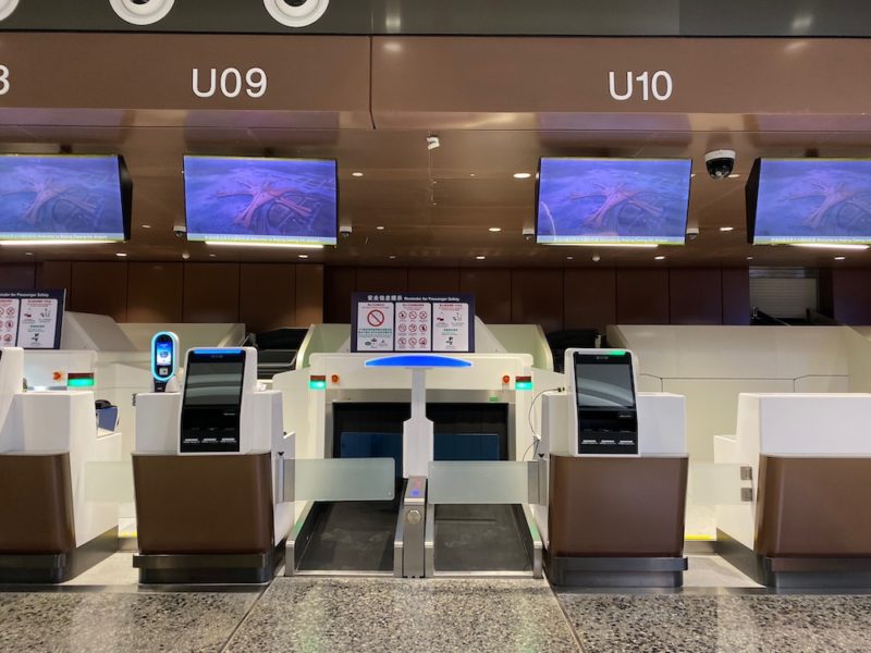 a check in area with monitors and screens