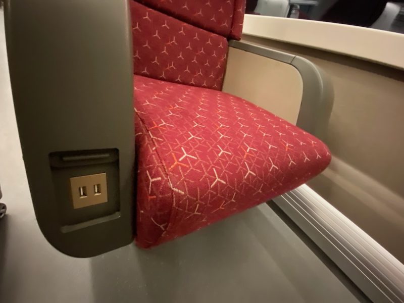 a red seat with a usb port