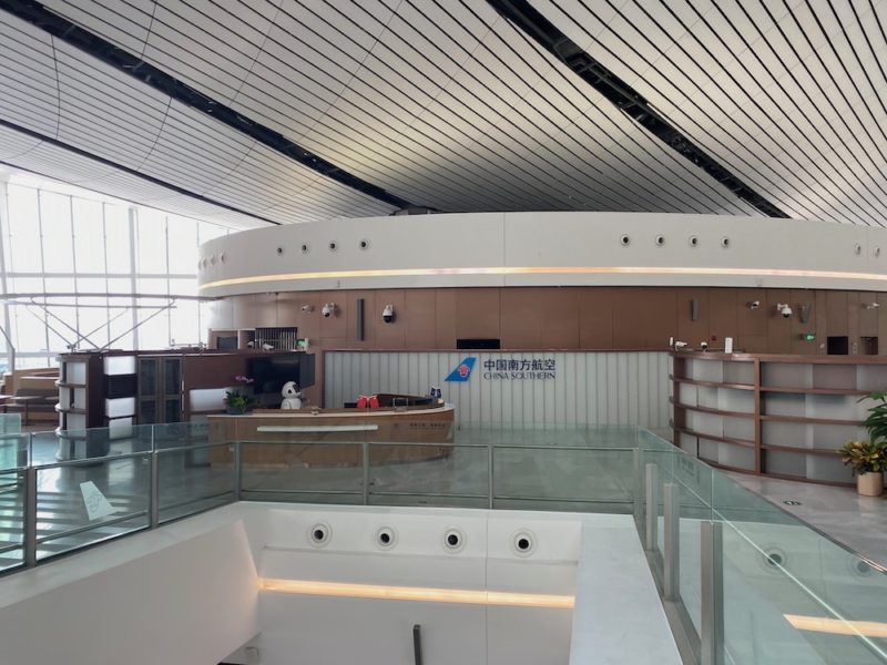 a large office with a glass railing