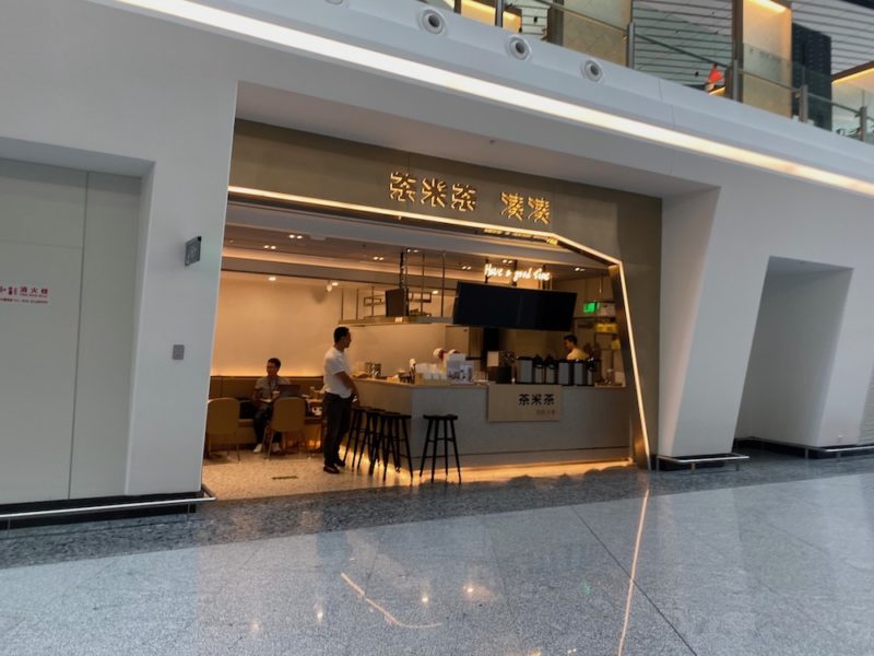 a man standing at a counter in a building