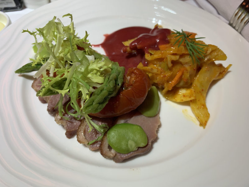 a plate of food on a white surface