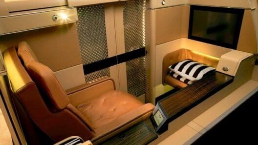 a seat and a bed in a room