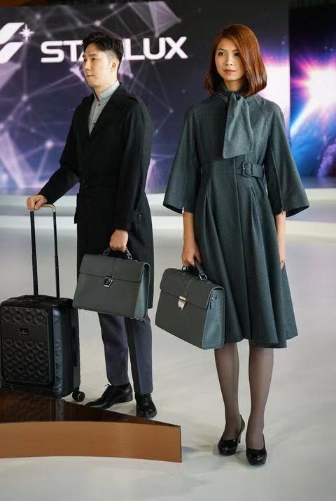 a man and woman holding luggage