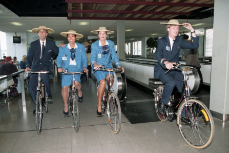 a group of people riding bicycles