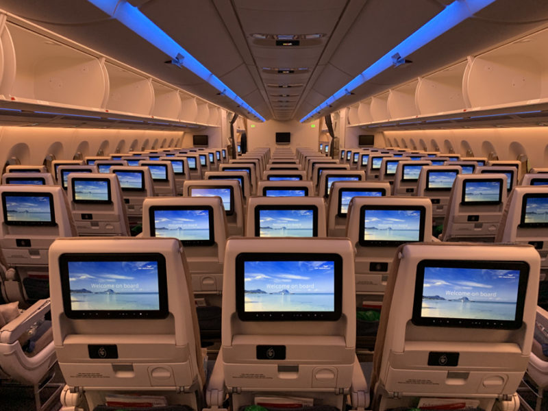 rows of seats with monitors on them