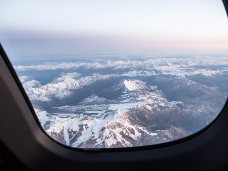 a view of mountains from an airplane window