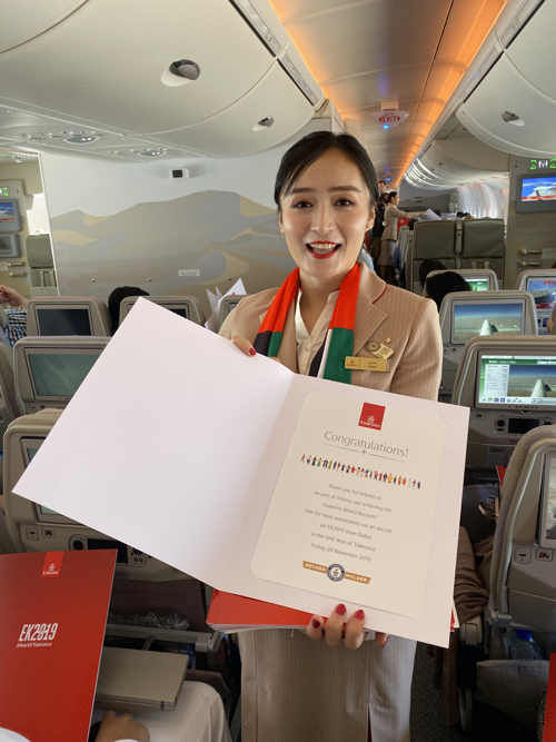 a woman holding a piece of paper in an airplane